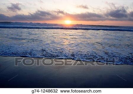 Sunset on the Pacific Ocean seashore of California, USA View Large Photo Image Stock Image - Sunset on the Pacific Ocean seashore of California, USA. Fotosearch