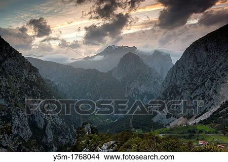 Sunset over Cueto del Ave, eastern massif of the Picos de Europa National Park Andara from Linares village, Cantabria, Spain View Large Photo Image Picture - Sunset over Cueto del Ave, eastern massif of the Picos de Europa National Park Andara from Linares village, Cantabria, Spain. Fotosearch
