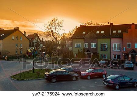 Picture - Sunset over housing estate in Lomianki, Poland.. Fotosearch