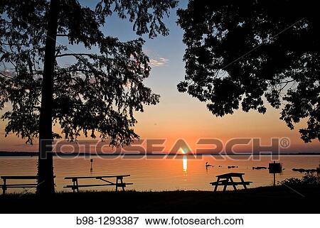 Stock Photo - Sunset over James River at Jamestown National Historic Site, virginia. Fotosearch