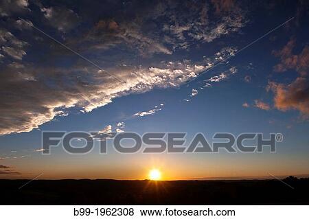 Stock Photo - SUNSET OVER LAND.. Fotosearch