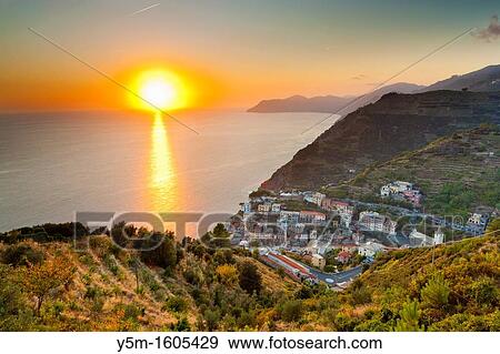 Sunset over Riomaggiore, Cinque Terre National Park, Province of La Spezia, Liguria, Italy, Europe View Large Photo Image Stock Photo - Sunset over Riomaggiore, Cinque Terre National Park, Province of La Spezia, Liguria, Italy, Europe. Fotosearch