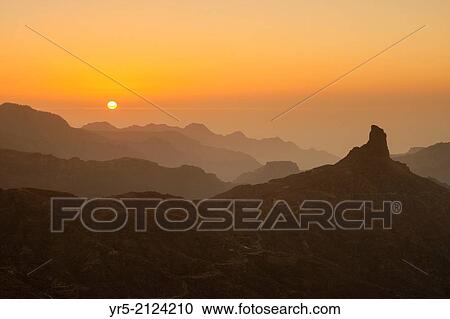 Stock Image - Sunset over Roque Bentaiga on Gran Canaria, Canary Islands, Spain.. Fotosearch