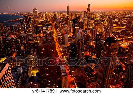 Sunset over the Chicago skyline looking south from the Hancock Tower along the lake front in Chicago, IL, USA View Large Photo Image Stock Image - Sunset over the Chicago skyline looking south from the Hancock Tower along the lake front in Chicago, IL, USA. Fotosearch