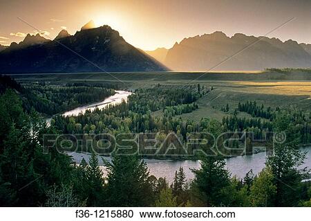 Sunset over the Grand Teton mountain from the Snake River Overlook, Grand Teton National Park, WYOMING View Large Photo Image Stock Image - Sunset over the Grand Teton mountain from the Snake River Overlook, Grand Teton National Park, WYOMING. Fotosearch