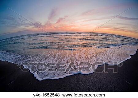 Stock Photo - Sunset over the Gulf of Mexico from Venice Beach Florida. Fotosearch