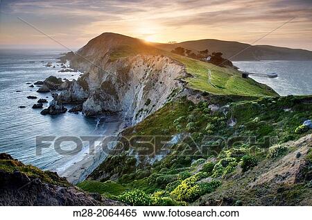 Stock Photography - Sunset over the headlands near Chimney Rock, Point Reyes National Seashore California.. Fotosearch
