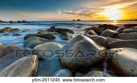 Sunset over the Porth Nanven, a rocky cove near Land's End, Cornwall, England, United Kingdom, Europe. View Large Photo Image Stock Photography - Sunset over the Porth Nanven, a rocky cove near Land's End, Cornwall, England, United Kingdom, Europe.. Fotosearch