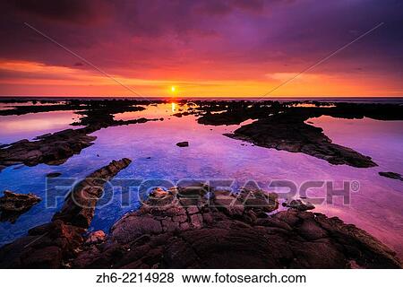 Stock Photo - Sunset over the royal fishponds at Hapaiali'i Heiau, Kona Coast, The Big Island, Hawaii USA.. Fotosearch