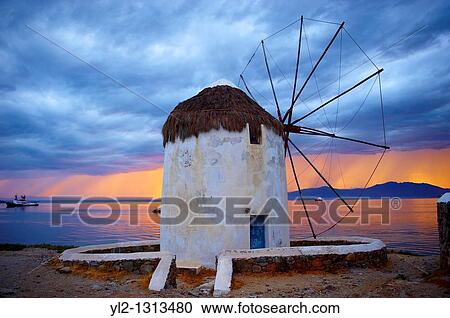 Sunset over the traditional Greek windmills of Mykonos Chora Cyclades Islands, Greece View Large Photo Image Stock Image - Sunset over the traditional Greek windmills of Mykonos Chora Cyclades Islands, Greece. Fotosearch