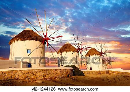 Sunset over the traditional Greek windmills of Mykonos Chora Cyclades Islands, Greece View Large Photo Image Stock Photograph - Sunset over the traditional Greek windmills of Mykonos Chora Cyclades Islands, Greece. Fotosearch