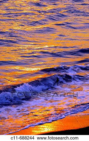Sunset reflected on sea waves, Florida, USA View Large Photo Image Picture - Sunset reflected on sea waves, Florida, USA. Fotosearch