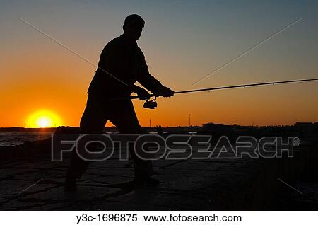 Sunset silhouette of Fisherman casting the fishing rod View Large Photo Image Stock Photography - Sunset silhouette of Fisherman casting the fishing rod. Fotosearch