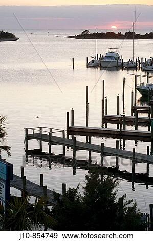 Sunset, Silver Lake harbor, Ocracoke Island, Outer Banks, North Carolina, USA View Large Photo Image Stock Photo - Sunset, Silver Lake harbor, Ocracoke Island, Outer Banks, North Carolina, USA. Fotosearch