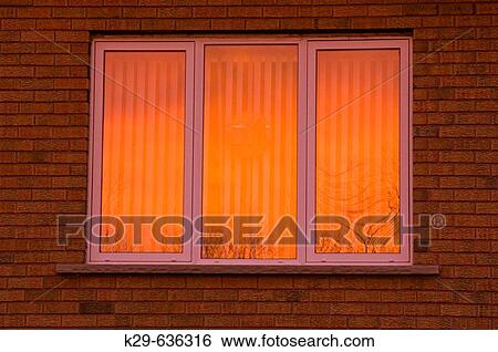 Stock Photograph - Sunset skies reflected in windows. Fotosearch