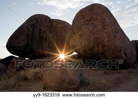 Stock Photo - Sunset through the Boulders - Mowani Mountain Camp - Twyfelfontein, Damaraland, Namibia, Africa. Fotosearch