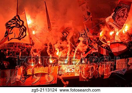 Supporters of german Bundesliga football club FC Koln, Koeln, Cologne celebrate with flares. View Large Photo Image Picture - Supporters of german Bundesliga football club FC Koln, Koeln, Cologne celebrate with flares.. Fotosearch