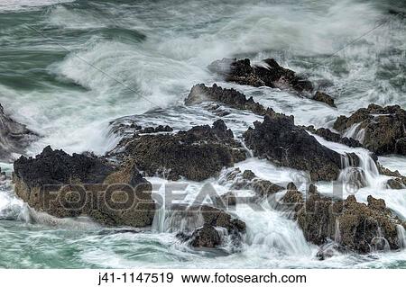 Surf breaking over rocks, Tumbledown Bay, Banks Peninsula, Canterbury, New Zealand View Large Photo Image Stock Photo - Surf breaking over rocks, Tumbledown Bay, Banks Peninsula, Canterbury, New Zealand. Fotosearch