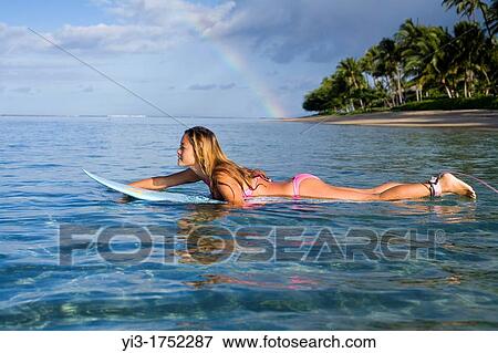 Surfer girl in Lahaina, Maui, Hawaii with rainbow View Large Photo Image Stock Photo - Surfer girl in Lahaina, Maui, Hawaii with rainbow. Fotosearch