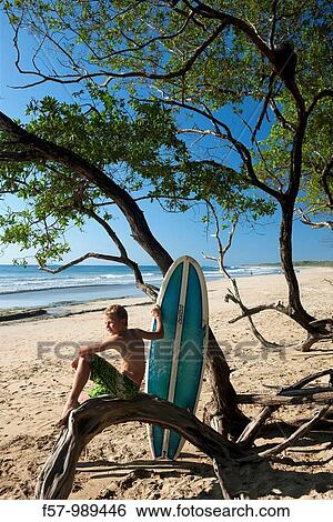 Stock Photograph - Surfer in Costa Rica, Central America. Fotosearch