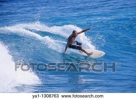 Surfer on wave, Pointe des aigrettes, Saint Gilles les Bains, La Reunion island (France), Indian Ocean View Large Photo Image Stock Image - Surfer on wave, Pointe des aigrettes, Saint Gilles les Bains, La Reunion island (France), Indian Ocean. Fotosearch