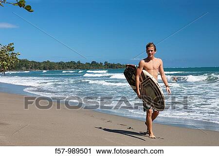 Surfers in Cahuita National Park, Costa Rica, Central America View Large Photo Image Stock Image - Surfers in Cahuita National Park, Costa Rica, Central America. Fotosearch