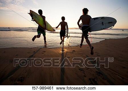 Surfers in Costa Rica, Central America View Large Photo Image Stock Image - Surfers in Costa Rica, Central America. Fotosearch