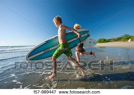 Surfers in Costa Rica, Central America View Large Photo Image Stock Photo - Surfers in Costa Rica, Central America. Fotosearch