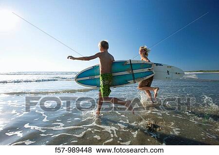 Surfers in Costa Rica, Central America View Large Photo Image Stock Photo - Surfers in Costa Rica, Central America. Fotosearch