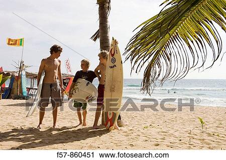 Surfers in Hikkaduwa, Sri Lanka View Large Photo Image Stock Image - Surfers in Hikkaduwa, Sri Lanka. Fotosearch