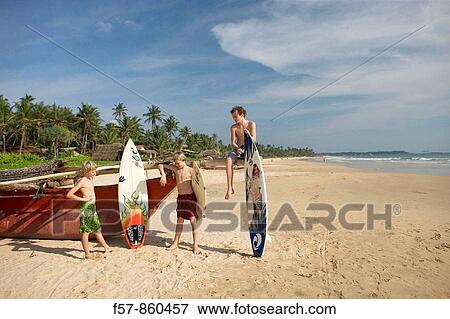 Surfers in Hikkaduwa, Sri Lanka View Large Photo Image Stock Photo - Surfers in Hikkaduwa, Sri Lanka. Fotosearch