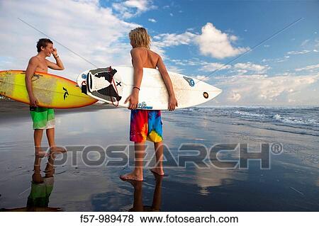Surfers on Playa Hermosa in Costa Rica, Central America View Large Photo Image Stock Photo - Surfers on Playa Hermosa in Costa Rica, Central America. Fotosearch