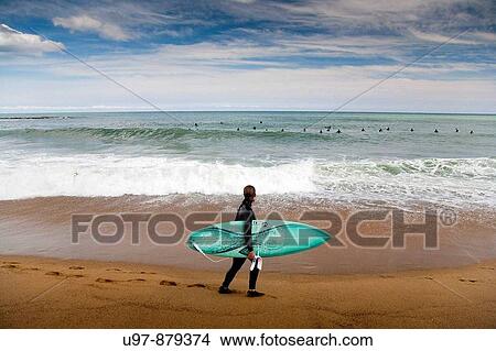 Picture - Surfing in La Barcelonata Beach, Barcelona, Catalonia, Spain. Fotosearch