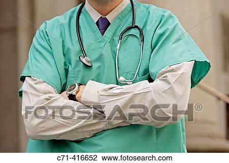 Surgeon arms folded View Large Photo Image Stock Image - Surgeon arms folded. Fotosearch