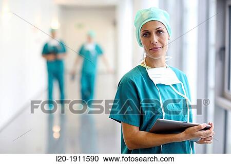 Stock Image - surgeon with tablet in the operating room hallway, Onkologikoa Hospital, Oncology Institute, Case Center for prevention, diagnosis and treatment of cancer, Donostia, San Sebastian, Gipuzkoa, Basque Country, Spain. Fotosearch