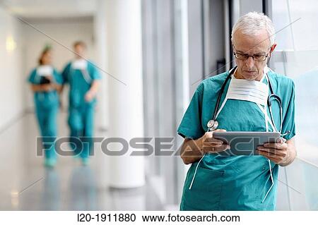 surgeon with tablet in the operating room hallway, Onkologikoa Hospital, Oncology Institute, Case Center for prevention, diagnosis and treatment of cancer, Donostia, San Sebastian, Gipuzkoa, Basque Country, Spain View Large Photo Image Stock Image - surgeon with tablet in the operating room hallway, Onkologikoa Hospital, Oncology Institute, Case Center for prevention, diagnosis and treatment of cancer, Donostia, San Sebastian, Gipuzkoa, Basque Country, Spain. Fotosearch