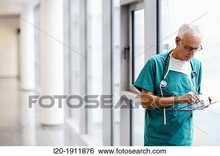 surgeon with tablet in the operating room hallway, Onkologikoa Hospital, Oncology Institute, Case Center for prevention, diagnosis and treatment of cancer, Donostia, San Sebastian, Gipuzkoa, Basque Country, Spain View Large Photo Image Stock Photograph - surgeon with tablet in the operating room hallway, Onkologikoa Hospital, Oncology Institute, Case Center for prevention, diagnosis and treatment of cancer, Donostia, San Sebastian, Gipuzkoa, Basque Country, Spain. Fotosearch
