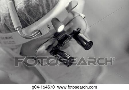 Stock Image - Surgeon working. Fotosearch
