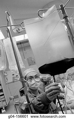 Surgeon working View Large Photo Image Stock Image - Surgeon working. Fotosearch