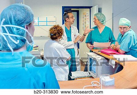 Surgeons at surgery area of hospital View Large Photo Image Stock Image - Surgeons at surgery area of hospital. Fotosearch