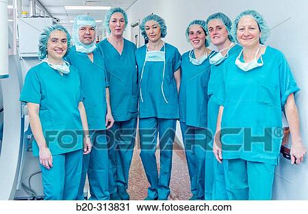 Stock Image - Surgeons at surgery area of hospital. Fotosearch