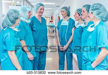 Stock Image - Surgeons at surgery area of hospital. Fotosearch