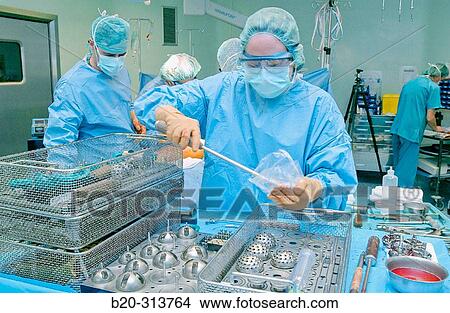 Surgeons at traumatology operating room of hospital View Large Photo Image Picture - Surgeons at traumatology operating room of hospital. Fotosearch