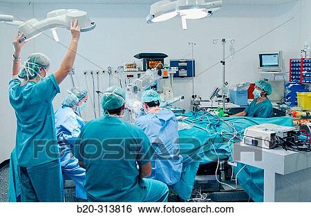 Surgeons during hearing operation at otorhinolaryngology operating room of hospital View Large Photo Image Stock Photograph - Surgeons during hearing operation at otorhinolaryngology operating room of hospital. Fotosearch