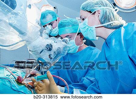 Surgeons during hearing operation at otorhinolaryngology operating room of hospital View Large Photo Image Stock Photography - Surgeons during hearing operation at otorhinolaryngology operating room of hospital. Fotosearch