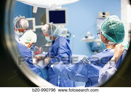 Surgeons in an operating room. Hospital Policlinica Gipuzkoa, San Sebastian, Donostia, Euskadi, Spain View Large Photo Image Stock Photograph - Surgeons in an operating room. Hospital Policlinica Gipuzkoa, San Sebastian, Donostia, Euskadi, Spain. Fotosearch