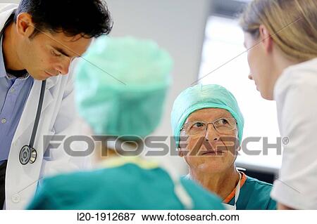 Stock Photo - Surgeons, medical meeting, clinical session, Onkologikoa Hospital, Oncology Institute, Case Center for prevention, diagnosis and treatment of cancer, Donostia, San Sebastian, Gipuzkoa, Basque Country, Spain. Fotosearch