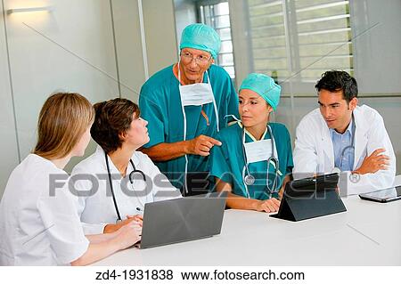 Stock Photo - Surgeons, medical meeting, clinical session, Onkologikoa Hospital, Oncology Institute, Case Center for prevention, diagnosis and treatment of cancer, Donostia, San Sebastian, Gipuzkoa, Basque Country, Spain. Fotosearch