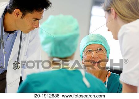 Stock Photograph - Surgeons, medical meeting, clinical session, Onkologikoa Hospital, Oncology Institute, Case Center for prevention, diagnosis and treatment of cancer, Donostia, San Sebastian, Gipuzkoa, Basque Country, Spain. Fotosearch