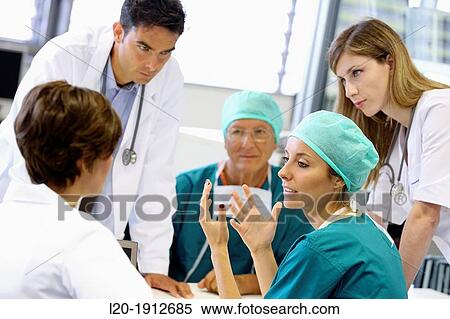 Stock Photography - Surgeons, medical meeting, clinical session, Onkologikoa Hospital, Oncology Institute, Case Center for prevention, diagnosis and treatment of cancer, Donostia, San Sebastian, Gipuzkoa, Basque Country, Spain. Fotosearch